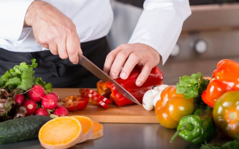 Image of a chef chopping vegetables
