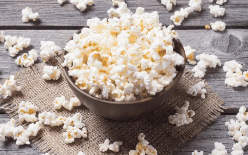 A bowl overflowing with popcorn