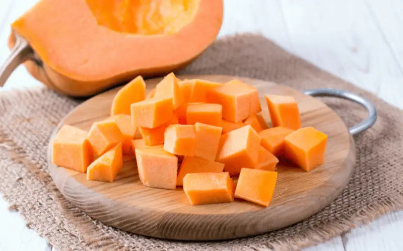 Pumpkin cubes on a cutting board